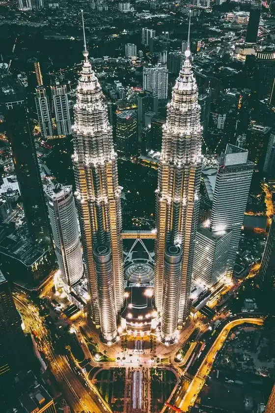 Aerial view of the Petronas Twin Towers and the Kuala Lumpur city centre at night