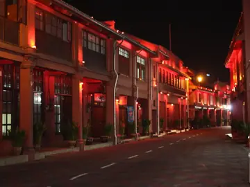 A street of heritage shophouses in Melaka, lit at night